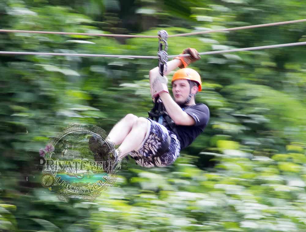 Guest ziplining through the Belize rainforest on Altun Ha and Zipline from Belize City