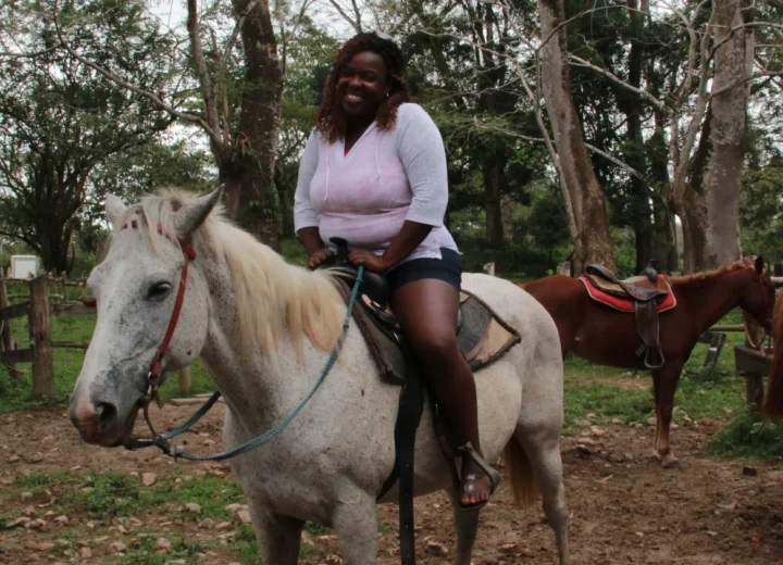 Guest horseback riding in Belize on a Xunantunich tour from Belize City