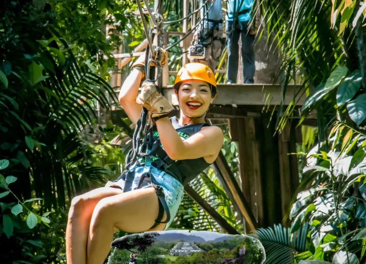Guest ziplining through the Belize jungle on a Xunantunich cave tubing adventure
