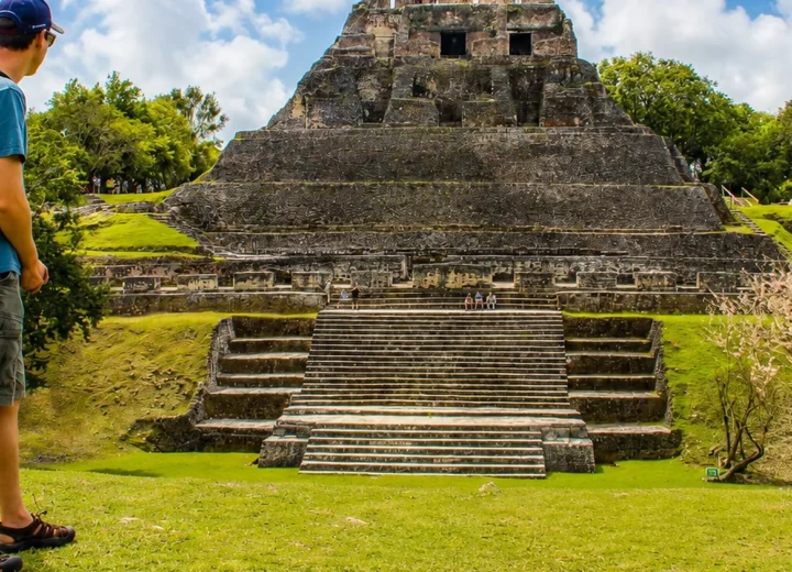 Traveler viewing El Castillo at Xunantunich on a private tour from Caye Caulker
